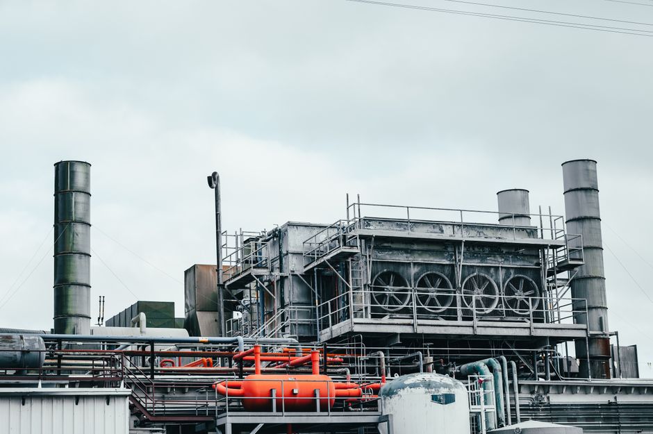 Technician performing a retrofit on aging industrial equipment