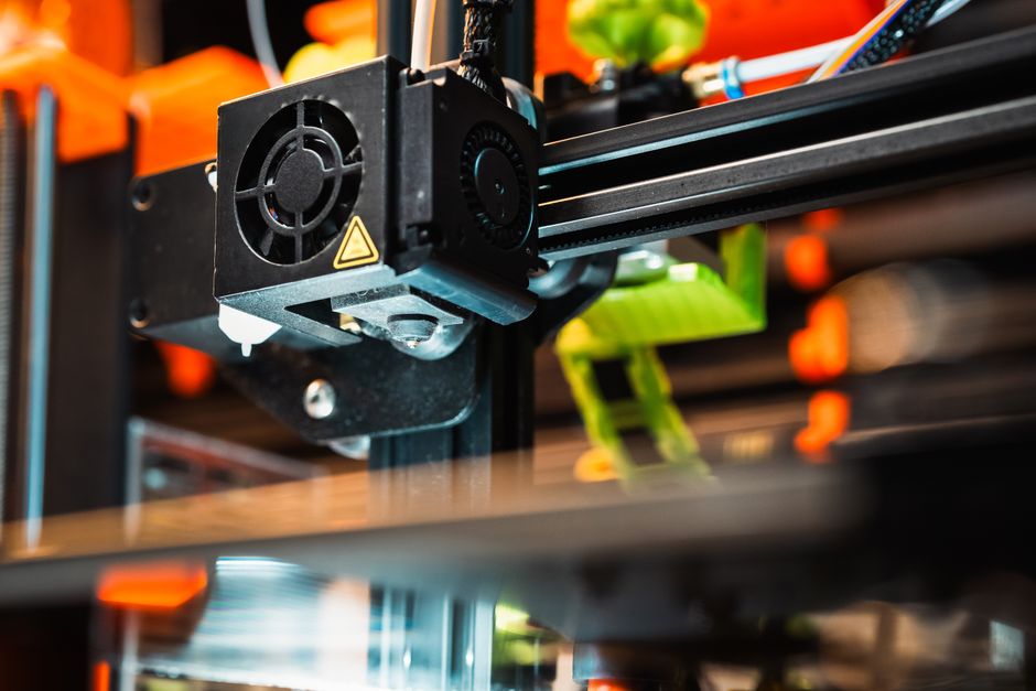 Engineer programming and testing an industrial machine prototype