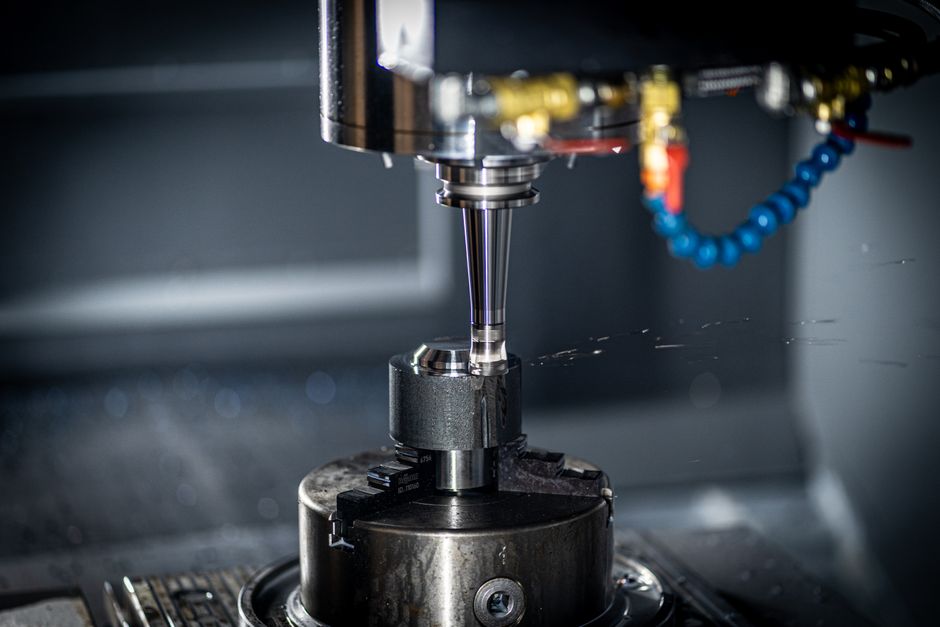 Precision part being machined on a 5-axis CNC milling center